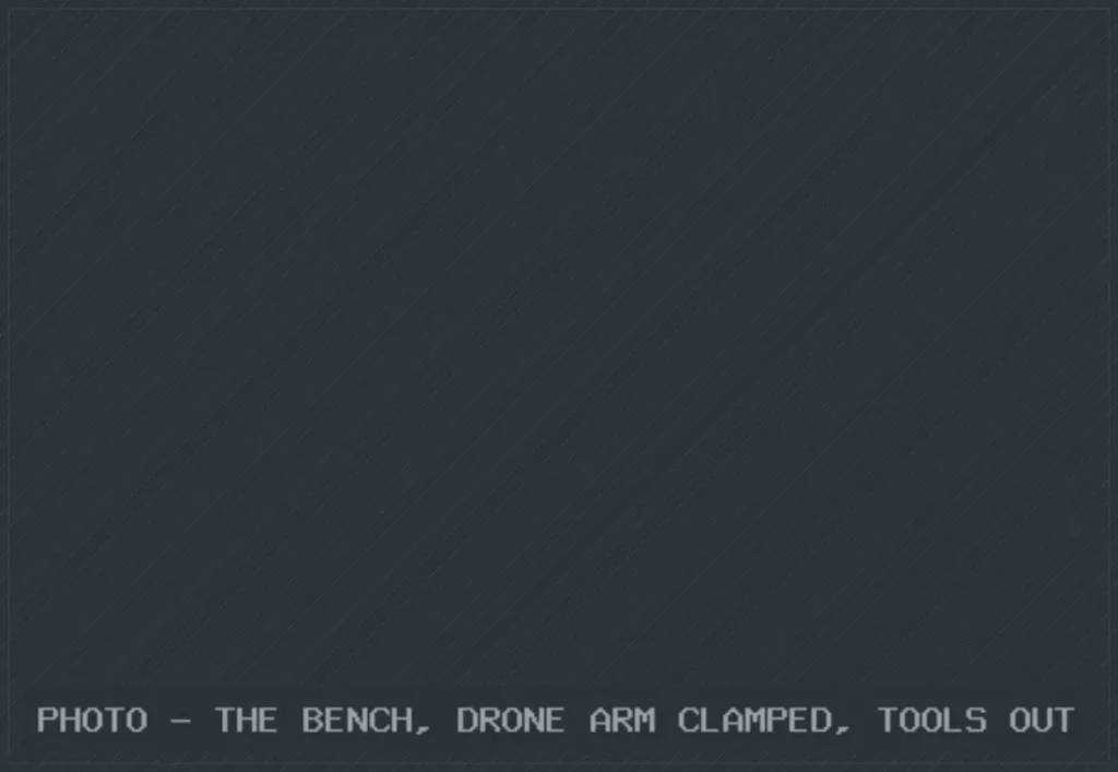 PHOTO - THE BENCH, DRONE ARM CLAMPED, TOOLS OUT